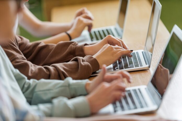 students-typing-on-laptops-GettyImages_1513744777.jpeg
